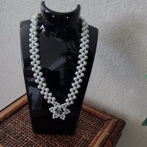 Glass beads necklace in White color and star-shaped pendant.